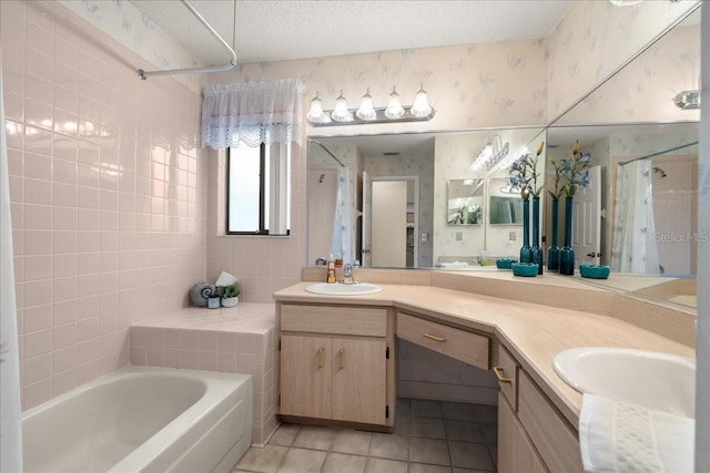 bathroom featuring tile patterned flooring, vanity, shower / bath combo, and a textured ceiling