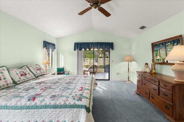 bedroom with ceiling fan, vaulted ceiling, access to exterior, and multiple windows