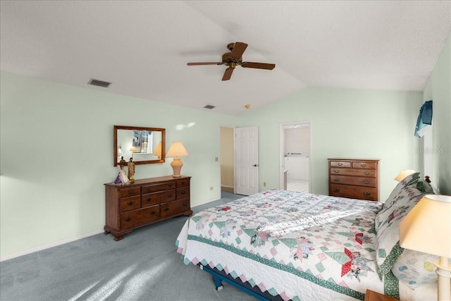 carpeted bedroom with ceiling fan, ensuite bathroom, and vaulted ceiling