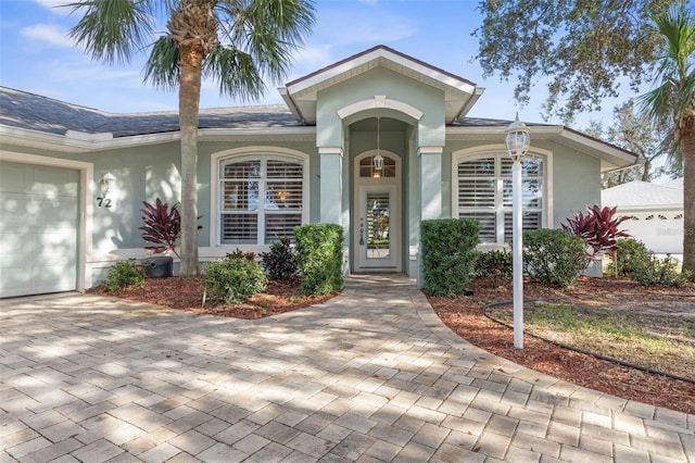 view of front of property with a garage