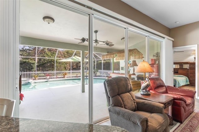 interior space with ceiling fan