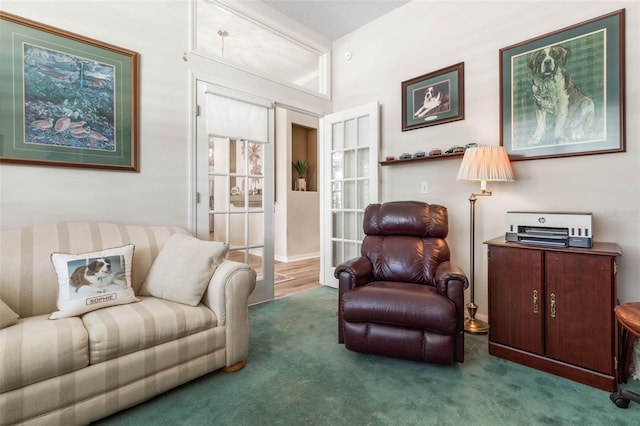 sitting room with french doors and carpet floors