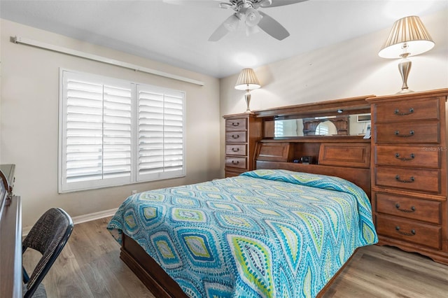 bedroom featuring hardwood / wood-style floors and ceiling fan