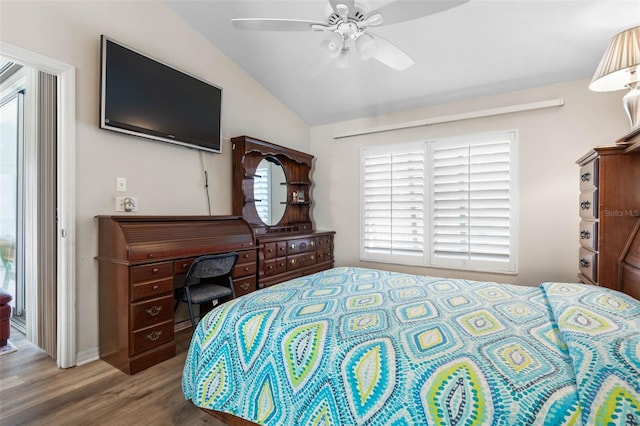 bedroom featuring ceiling fan, vaulted ceiling, and hardwood / wood-style flooring