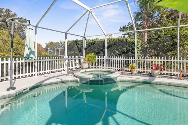 view of pool with an in ground hot tub and glass enclosure