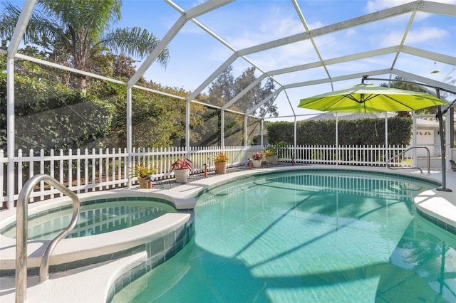 view of swimming pool featuring a lanai