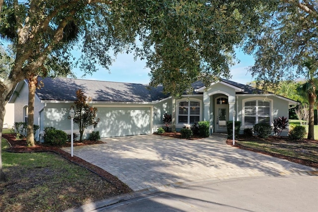 single story home with a garage