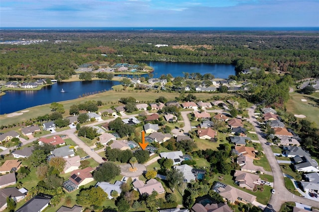 drone / aerial view with a water view