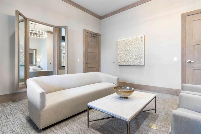 living room with ornamental molding and a chandelier