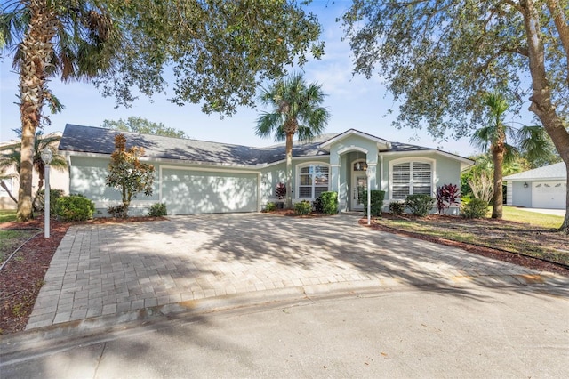 single story home featuring a garage