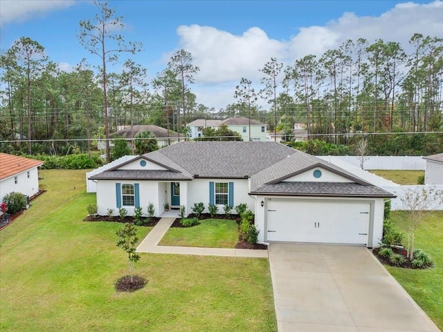 ranch-style house featuring a garage and a front yard