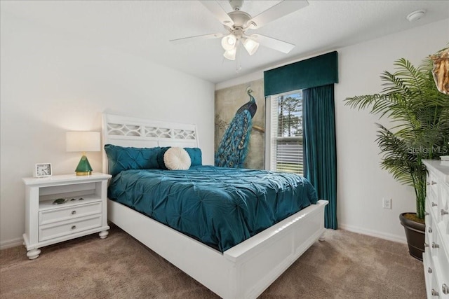 bedroom featuring ceiling fan and carpet