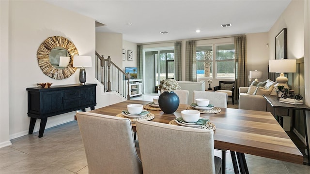 dining area featuring light tile patterned floors