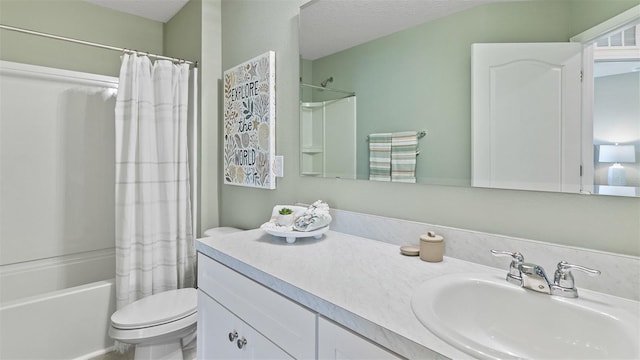 full bathroom featuring vanity, shower / bath combination with curtain, a textured ceiling, and toilet