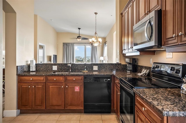 kitchen featuring ceiling fan with notable chandelier, vaulted ceiling, sink, black appliances, and light tile patterned flooring