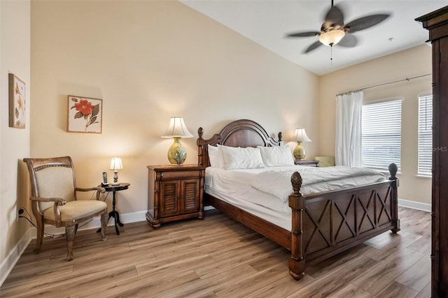 bedroom with ceiling fan and light hardwood / wood-style flooring