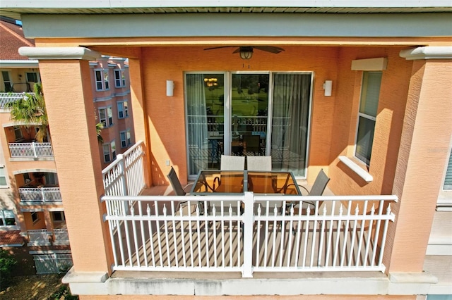 view of exterior entry featuring ceiling fan