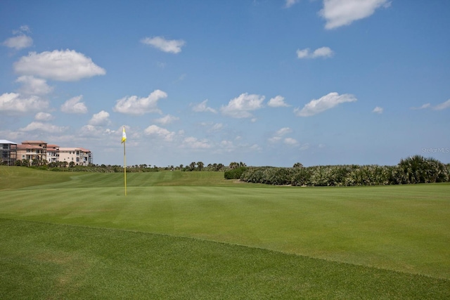 view of property's community with a yard