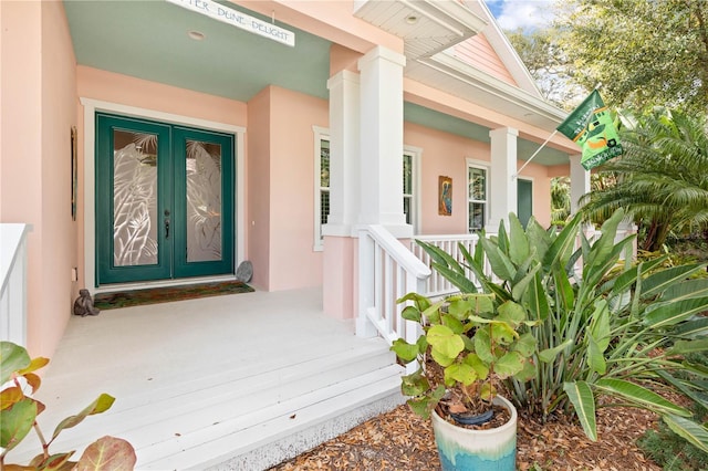 doorway to property featuring french doors and a porch