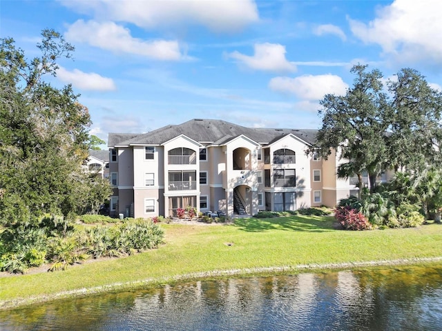 view of building exterior with a water view