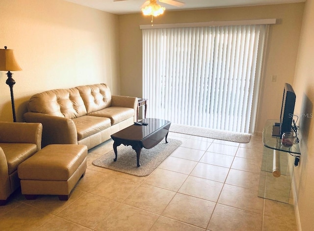 living room featuring ceiling fan and light tile patterned floors