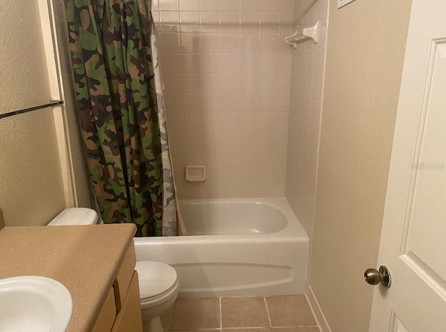 full bathroom featuring tile patterned flooring, shower / bath combination with curtain, toilet, and vanity