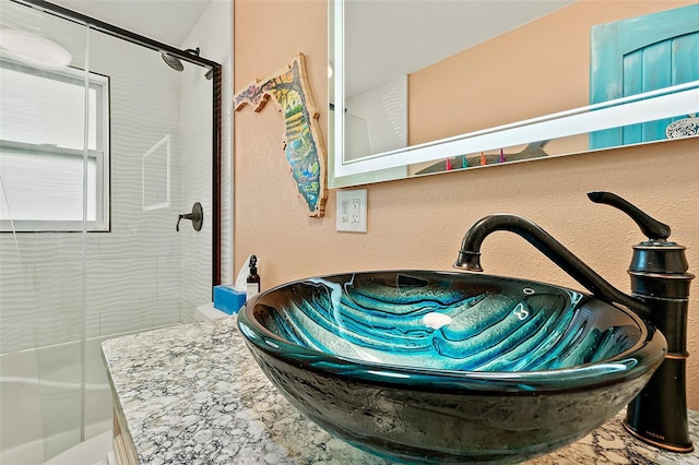 room details with a tile shower and sink