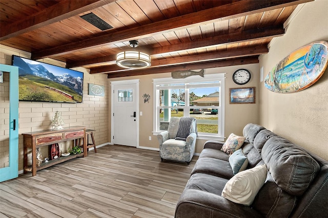 living room featuring light hardwood / wood-style floors, beam ceiling, and wood ceiling