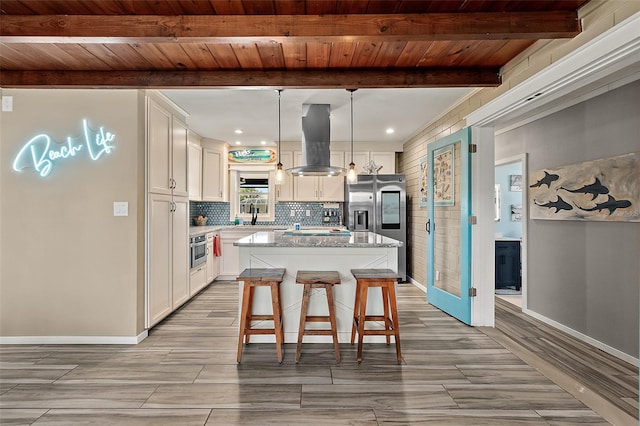 kitchen with wood ceiling, island range hood, pendant lighting, beamed ceiling, and a kitchen island