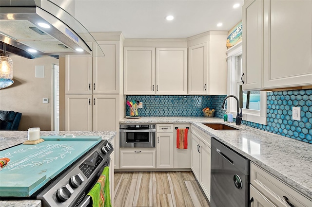 kitchen with stainless steel appliances, extractor fan, white cabinetry, and sink