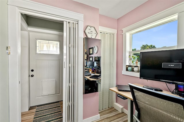 doorway with light hardwood / wood-style floors