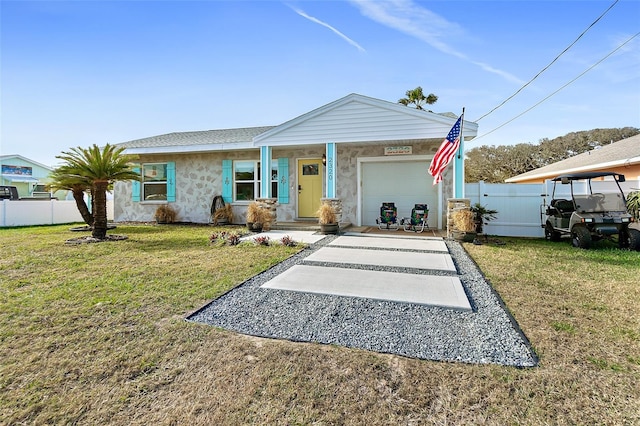 view of front of home featuring a garage and a front lawn