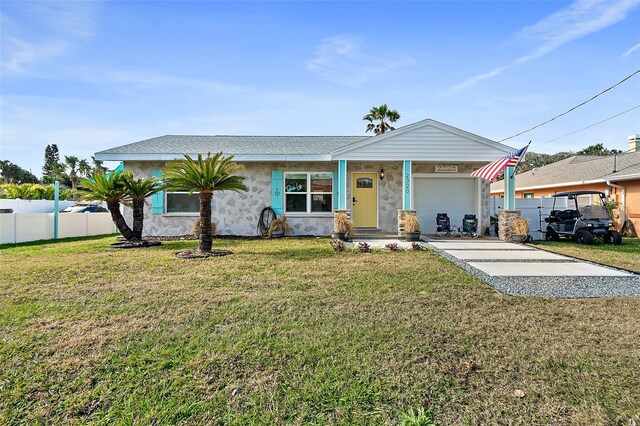 view of front facade with a front lawn and a garage