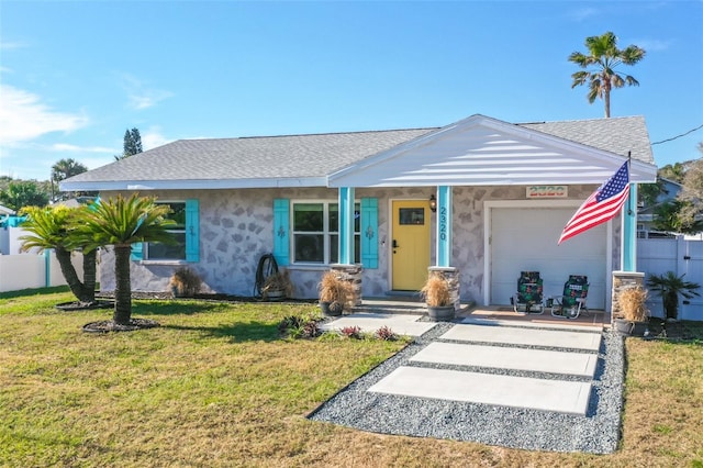 single story home with a garage and a front yard