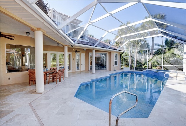 view of pool featuring ceiling fan, a lanai, and a patio