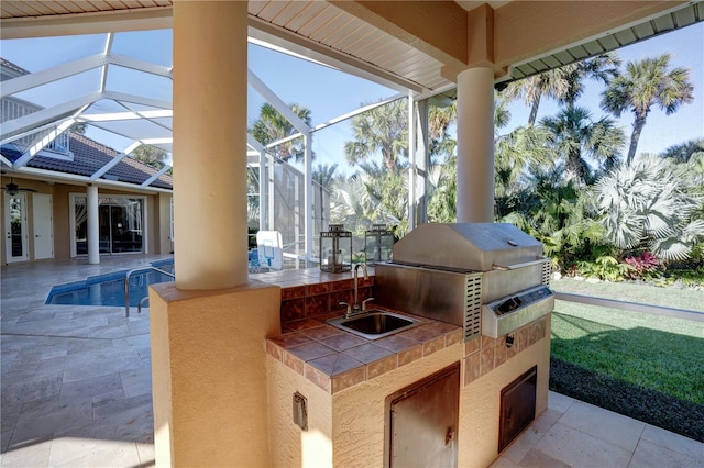 view of patio / terrace with an outdoor kitchen, sink, and a grill