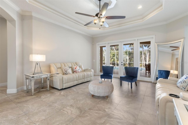 67 Island Estates Pkwy, Palm Coast, FL 32137 - living room with a raised ceiling, ornamental molding, french doors, ceiling fan, and baseboards