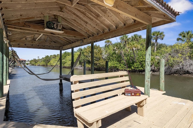67 Island Estates Pkwy, Palm Coast, FL 32137 - dock with a water view and view of wooded area