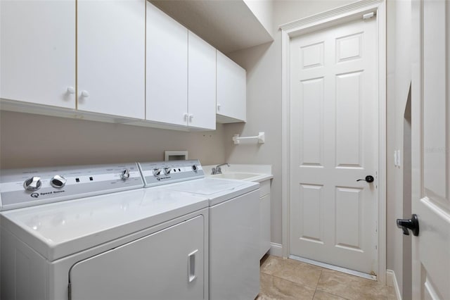 67 Island Estates Pkwy, Palm Coast, FL 32137 - laundry room with washer and clothes dryer, cabinet space, baseboards, and light tile patterned floors