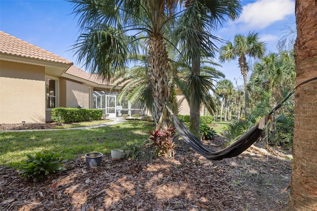 67 Island Estates Pkwy, Palm Coast, FL 32137 - view of grassy yard with a sunroom