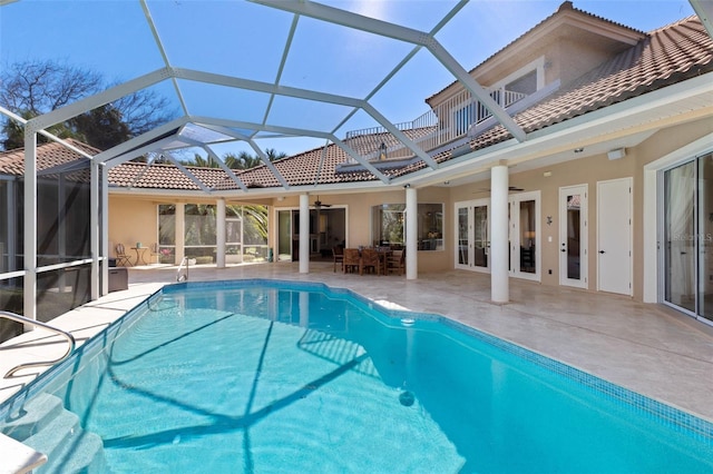 67 Island Estates Pkwy, Palm Coast, FL 32137 - outdoor pool with a ceiling fan, a patio, french doors, and a lanai