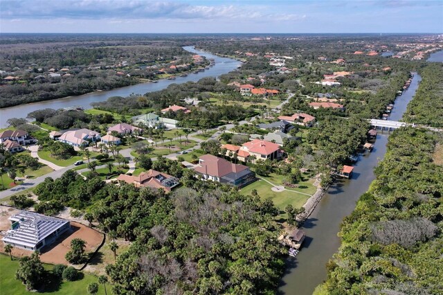 67 Island Estates Pkwy, Palm Coast, FL 32137 - aerial view of property and surrounding area with a large body of water and nearby suburban area