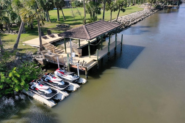 67 Island Estates Pkwy, Palm Coast, FL 32137 - dock featuring boat lift, a water view, and a yard