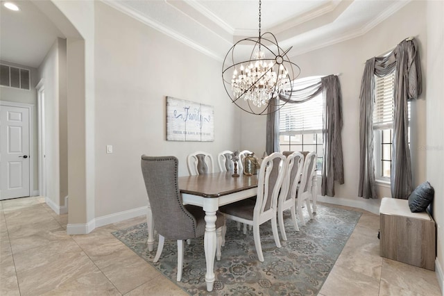 67 Island Estates Pkwy, Palm Coast, FL 32137 - dining space featuring crown molding, arched walkways, a chandelier, baseboards, and a raised ceiling