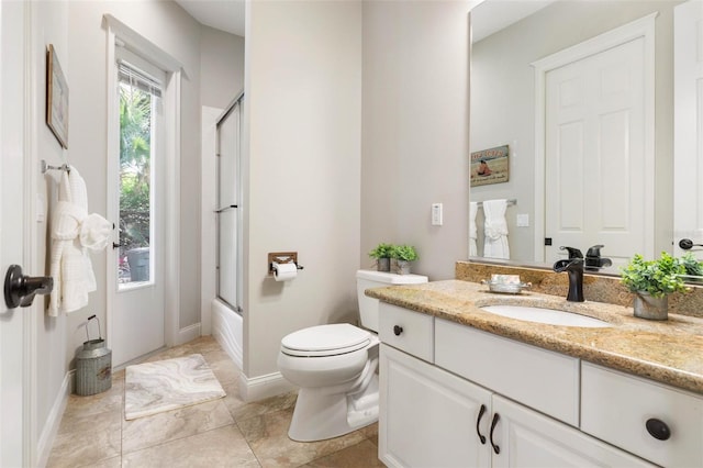 67 Island Estates Pkwy, Palm Coast, FL 32137 - bathroom featuring vanity, toilet, enclosed tub / shower combo, and baseboards