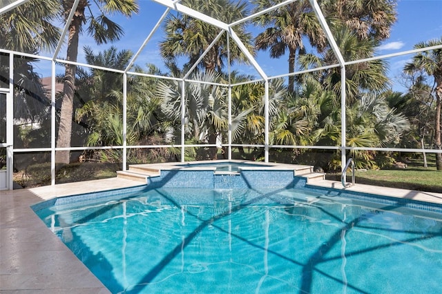 67 Island Estates Pkwy, Palm Coast, FL 32137 - view of swimming pool featuring a lanai, a pool with connected hot tub, and a patio area