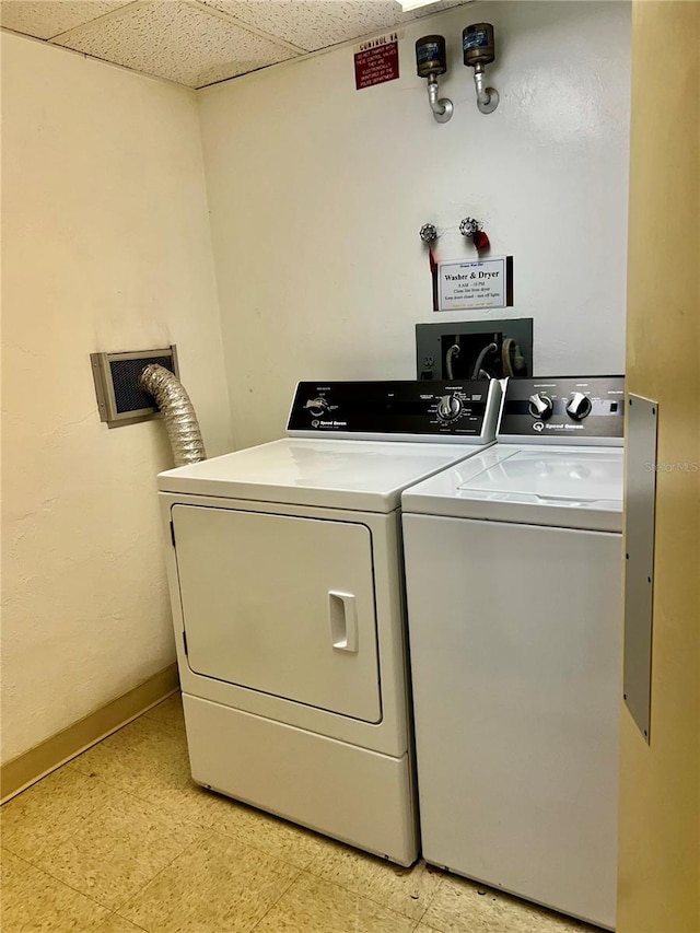 clothes washing area featuring washing machine and dryer