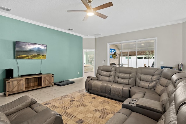 tiled living room with ceiling fan, ornamental molding, and a textured ceiling