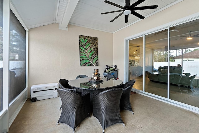 sunroom with vaulted ceiling with beams and ceiling fan