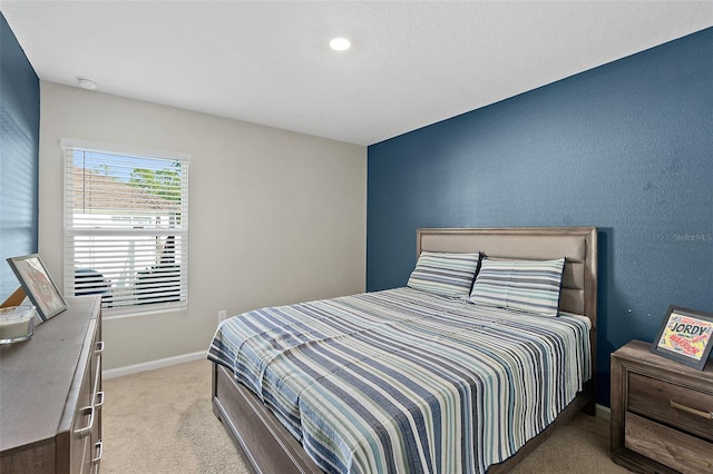 bedroom featuring light carpet